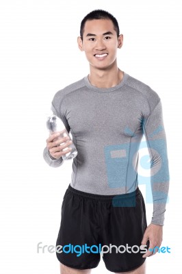 Fitness Man Posing With Water Bottle Stock Photo