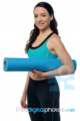 Fitness Woman With A Gym Mat Stock Photo