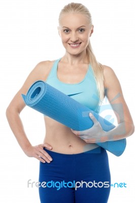 Fitness Woman With An Excercise Mat Stock Photo