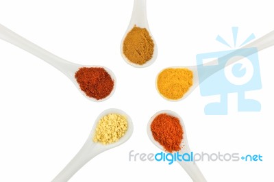 Five Seasoning Spices On Porcelain Spoons Stock Photo