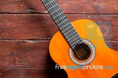 Flamenco Guitar On Wood Background Illuminated By Natural Daylight Stock Photo