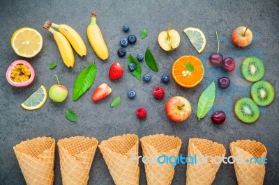 Flat Lay Various Fresh Fruits Setup On Dark Stone Background . S… Stock Photo