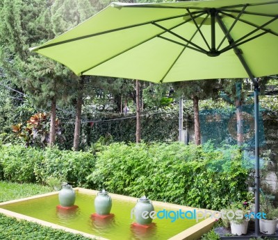 Flaxen Garden Umbrella In Summer Stock Photo