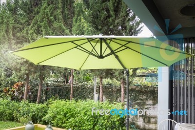 Flaxen Garden Umbrella In Summer Stock Photo