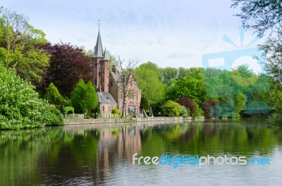 Flemish Style Building Reflecting In Minnewater Lake Stock Photo