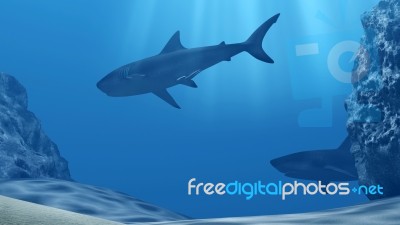 Flock Of Sharks Underwater With Sun Rays And Stones In Deep Blue Sea Stock Image