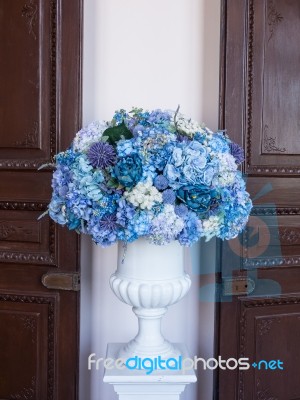 Flower Arrangement Of Colorful Summer Blooms In A White Pottery Stock Photo