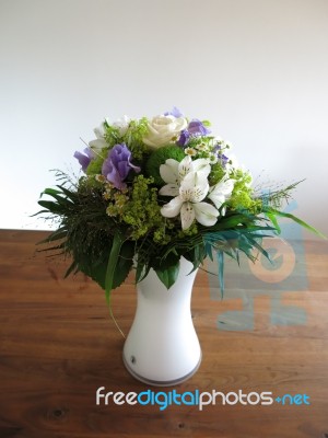 Flower Bouquet On Wooden Table Stock Photo