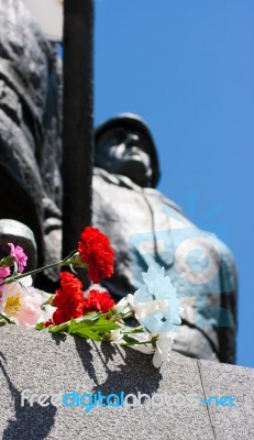 Flowers Near The Monument On Victory Day Stock Photo