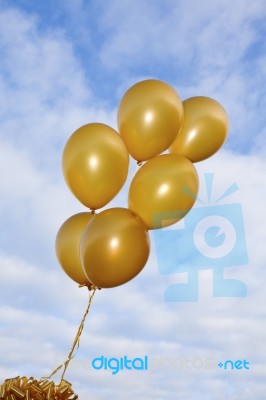 Flying Golden Balloons Stock Image