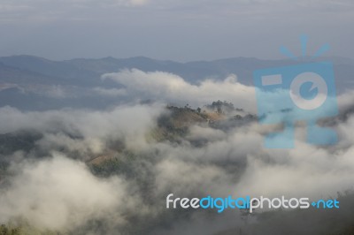 Fog Over The Mountain Stock Photo