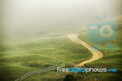 Foggy Morning In A Village On The Hills Stock Photo