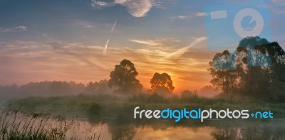 Foggy River In The Morning Stock Photo