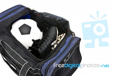 Football And Shoes In holdall bag Stock Photo