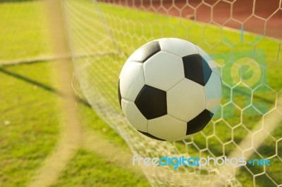 Football In Goal Stock Photo