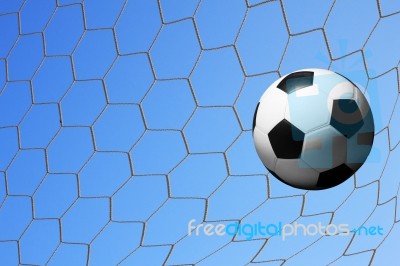 Football In Goal Net Stock Photo