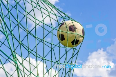 Football Shot In Goal Net Stock Photo