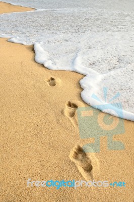 Footprints On Beach Stock Photo