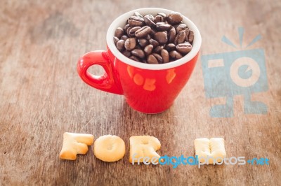 For U Alphabet Biscuit With Red Coffee Cup Stock Photo