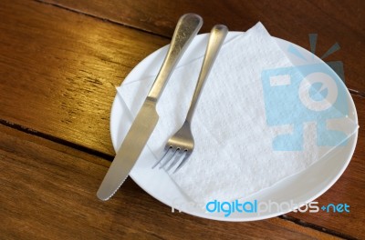 Fork And Knife With White Plate Stock Photo