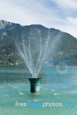 Fountain In Lake Wolfgang At St. Gilgen Stock Photo