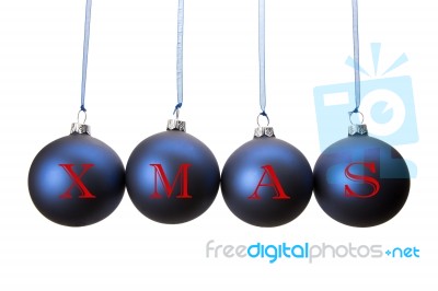 Four Blue Christmas Balls With Letters Of Word Xmas Stock Photo