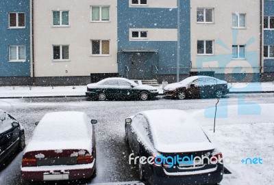 Four Cars Near The House In The Snow Stock Photo