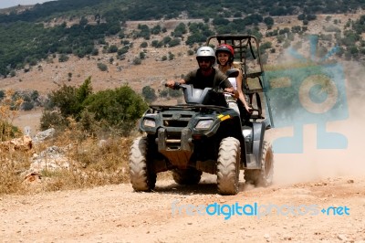 Four Wheeler Riding Stock Photo