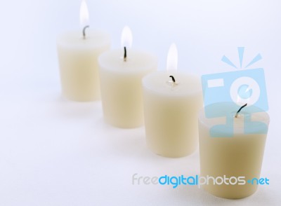 Four White Candles Stock Photo