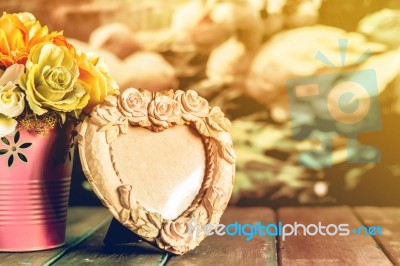 Frame And Vase On The Table Stock Photo