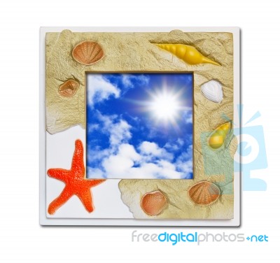 Frame Of Sea Shell On Blue Sky Stock Photo