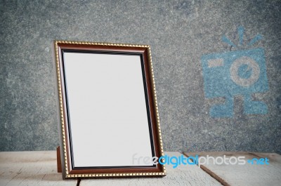 Frame On Wooden Table Stock Photo