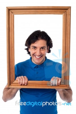 Framed Interest, Smiling Young Male Stock Photo