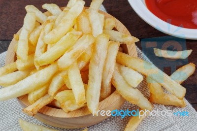 French Fries On Wooden Stock Photo