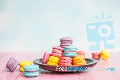 French Macarons On Pink Wooden Background. Vintage Style Stock Photo