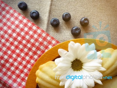 French Madeleines With Blueberries Top View Stock Photo