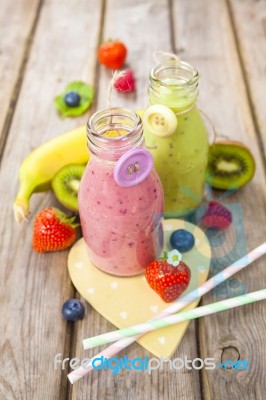 Fresh Blended Fruit Smoothies In Vintage Milk Bottles Stock Photo