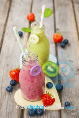 Fresh Blended Fruit Smoothies In Vintage Milk Bottles Stock Photo