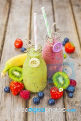 Fresh Blended Fruit Smoothies In Vintage Milk Bottles Stock Photo