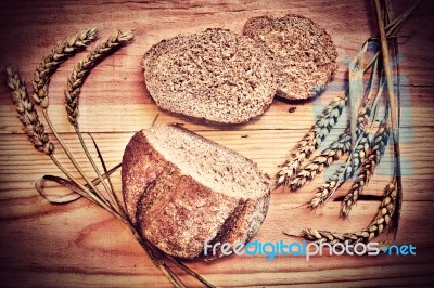 Fresh Bread On A Wooden Table Stock Photo