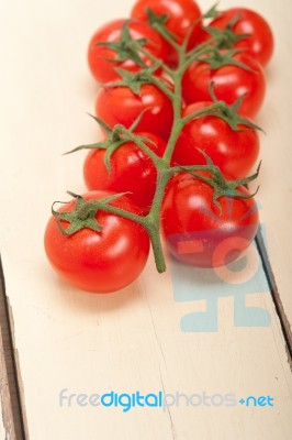 Fresh Cherry Tomatoes On A Cluster Stock Photo