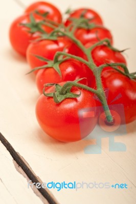 Fresh Cherry Tomatoes On A Cluster Stock Photo