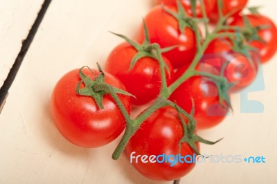 Fresh Cherry Tomatoes On A Cluster Stock Photo