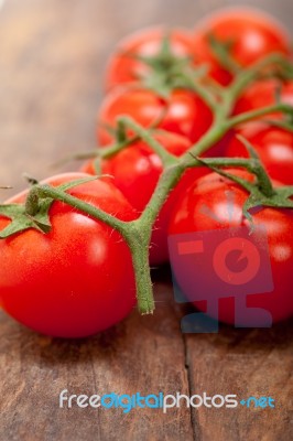 Fresh Cherry Tomatoes On A Cluster Stock Photo