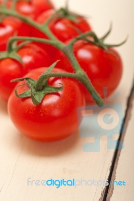 Fresh Cherry Tomatoes On A Cluster Stock Photo