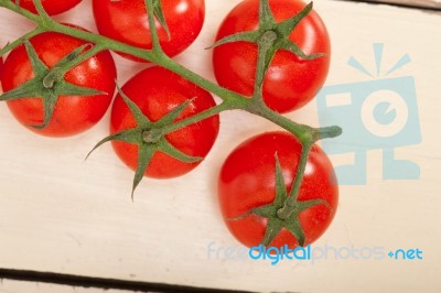 Fresh Cherry Tomatoes On A Cluster Stock Photo