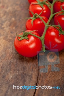 Fresh Cherry Tomatoes On A Cluster Stock Photo