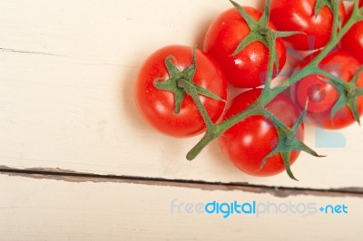 Fresh Cherry Tomatoes On A Cluster Stock Photo