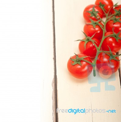 Fresh Cherry Tomatoes On A Cluster Stock Photo