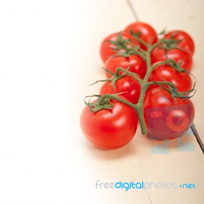 Fresh Cherry Tomatoes On A Cluster Stock Photo